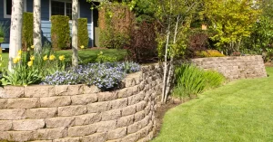 Functional retaining wall construction stabilizing soil across uneven yard elevations